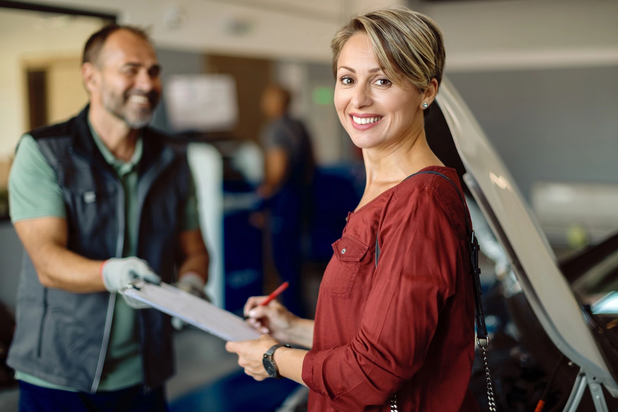 happy car owner at auto shop